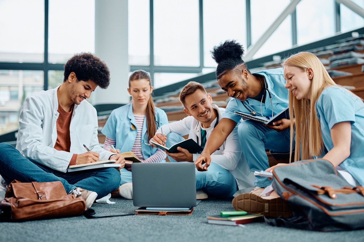 Group of happy medical students using laptop.